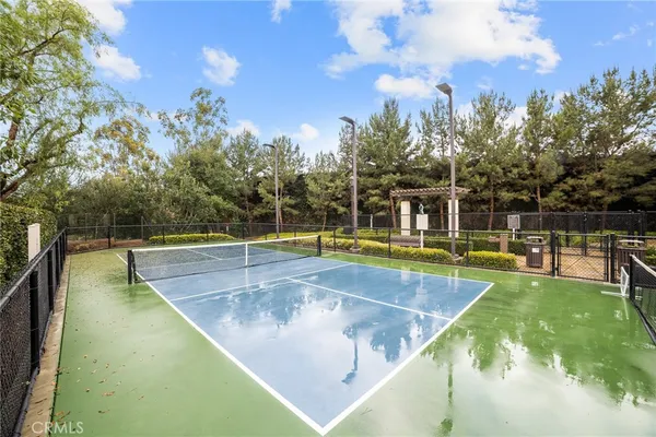 a view of a swimming pool with an outdoor seating