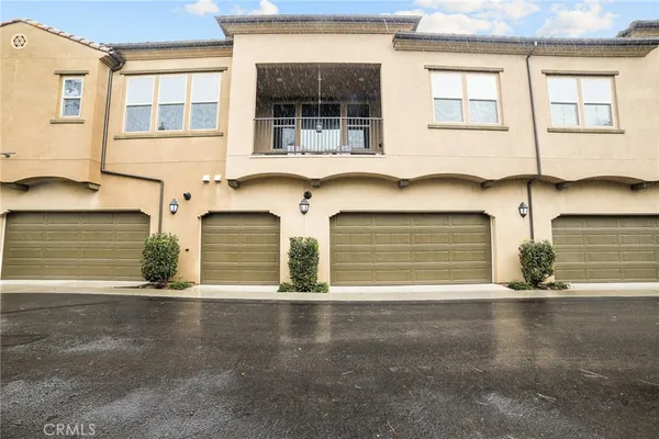 a front view of a house with a garage