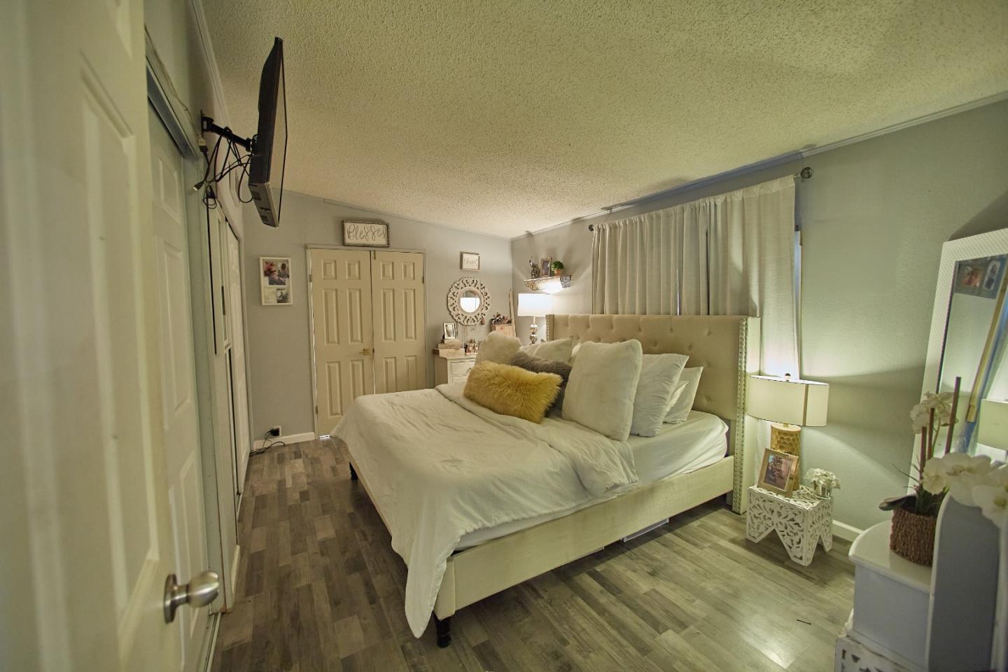 20 Russell Road, Unit 9 Salinas, CA 93906 - Photo 9 of 25 a bedroom with a bed and a mirror