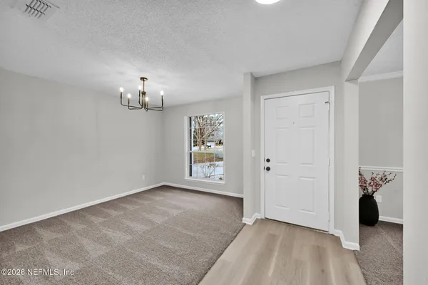 a kitchen with stainless steel appliances granite countertop a sink a stove and a wooden floors