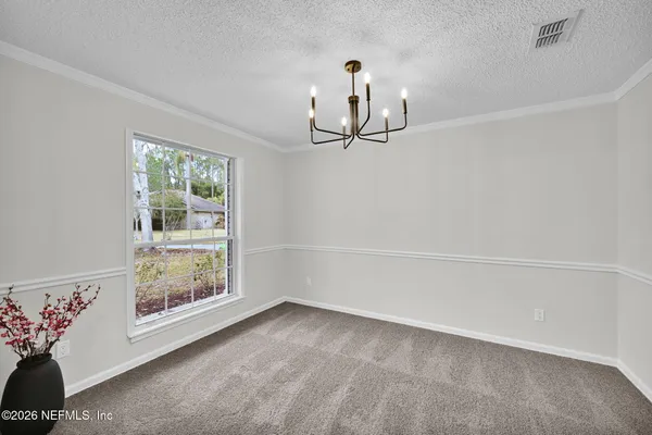 a view of livingroom with kitchen and furniture