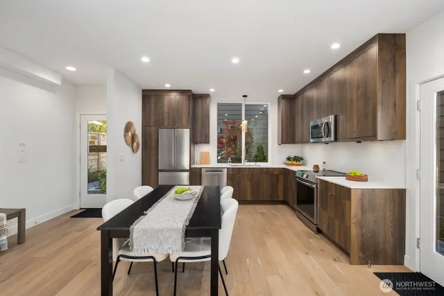 a view of a dining room with furniture window and wooden floor