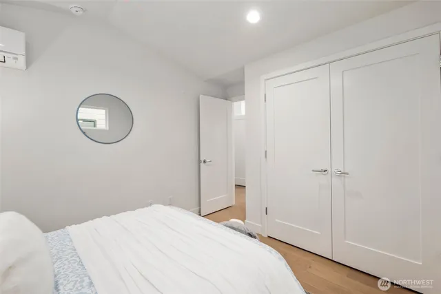 a bedroom with a bed and window