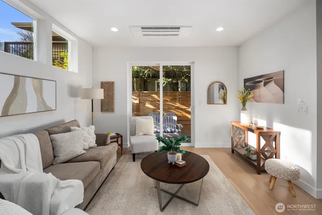 a kitchen with stainless steel appliances granite countertop a sink a stove and a microwave