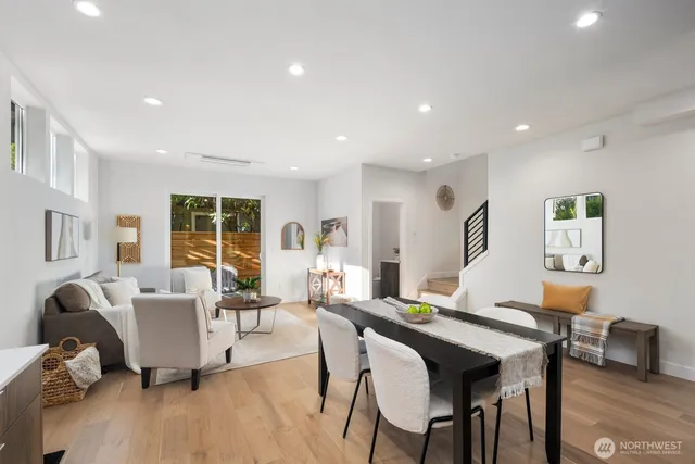 a view of a dining room with furniture and wooden floor