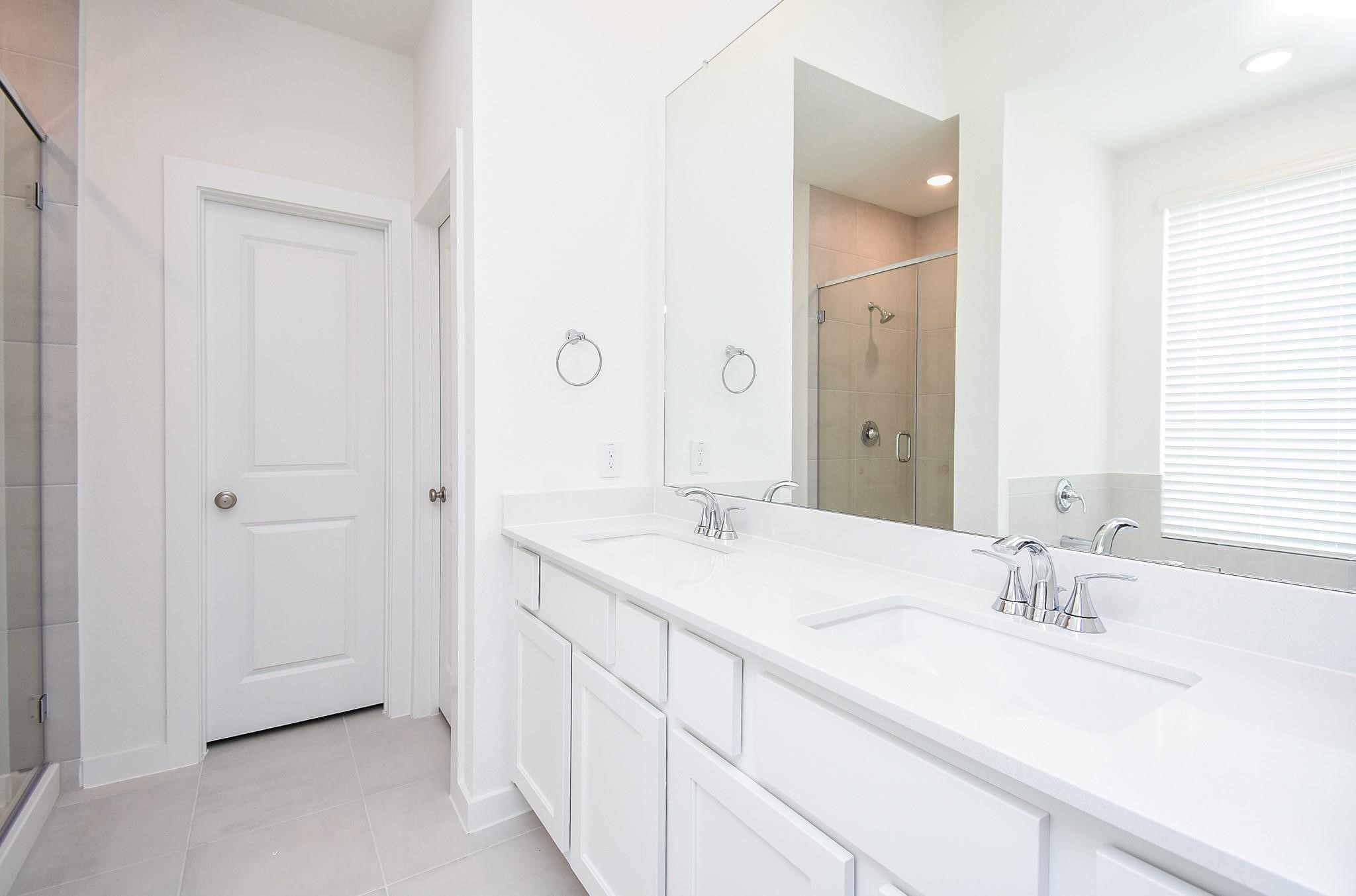 5115 Murillo Drive Manvel, TX 77578 - Photo 18 of 31 a bathroom with a sink and a mirror