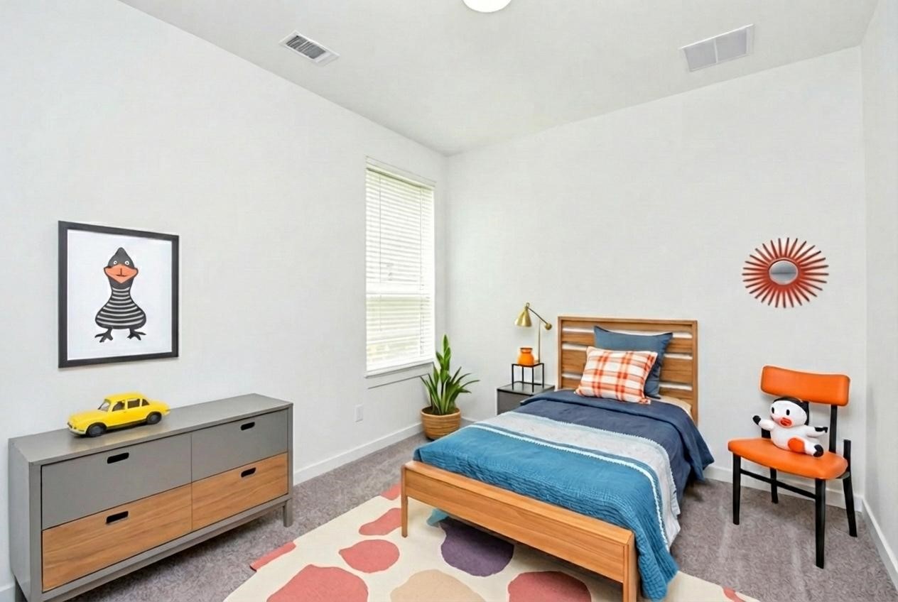 5115 Murillo Drive Manvel, TX 77578 - Photo 19 of 31 a bedroom with a bed and a couch