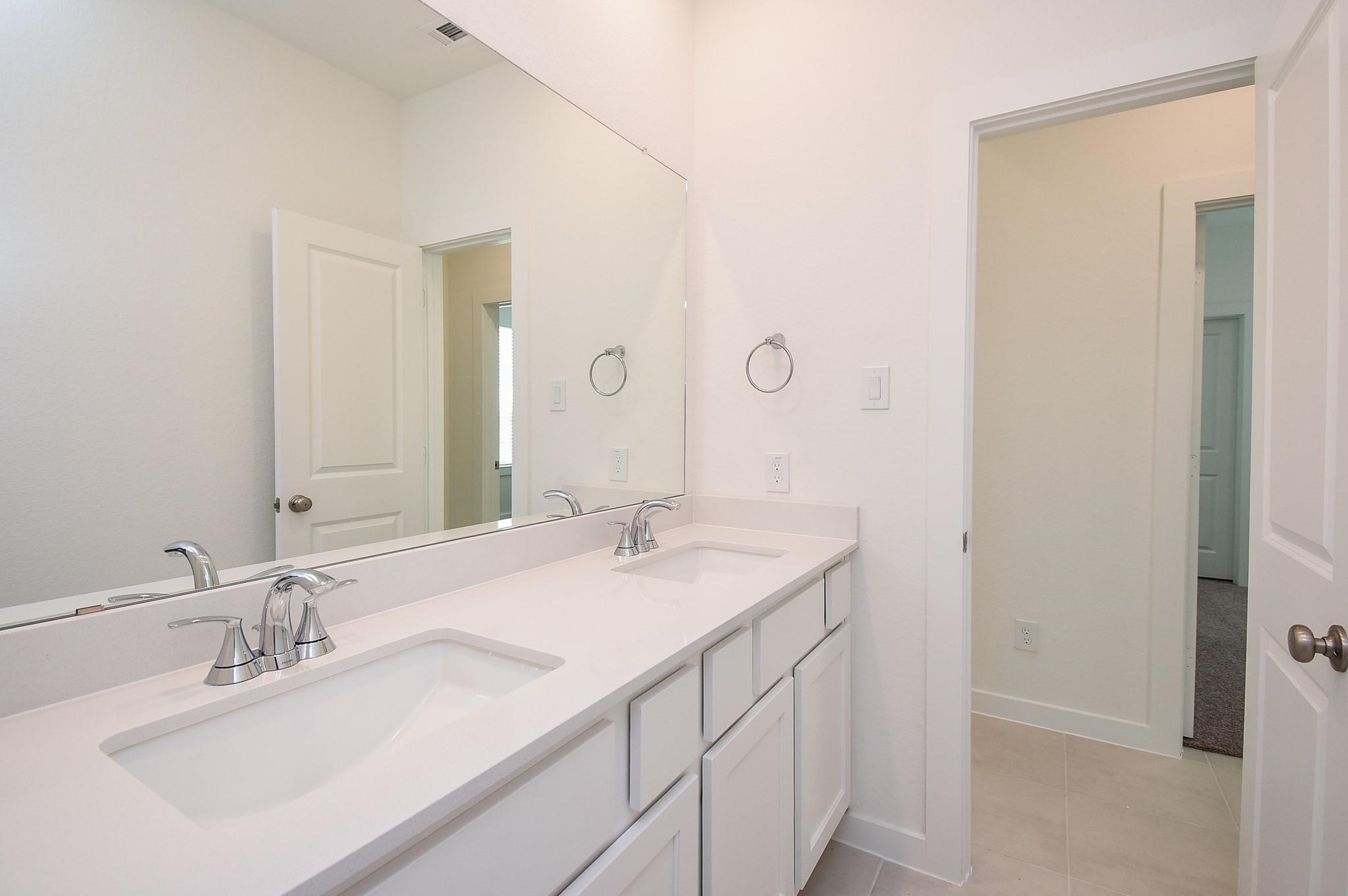 5115 Murillo Drive Manvel, TX 77578 - Photo 20 of 31 a bathroom with a sink and a mirror