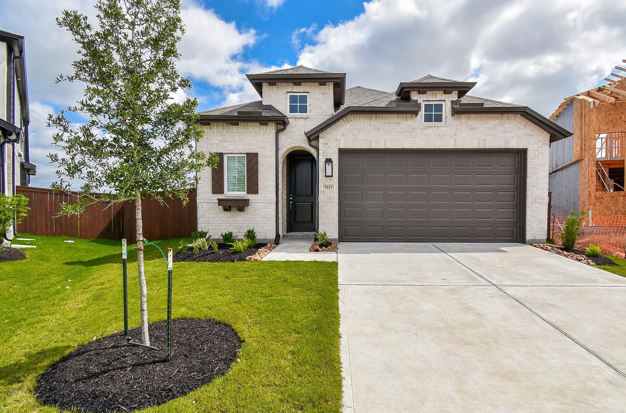 5115 Murillo Drive Manvel, TX 77578 - Photo 2 of 31 a front view of a house with garden