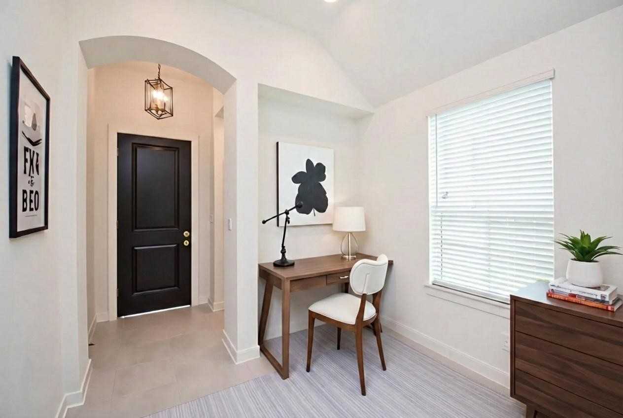 5115 Murillo Drive Manvel, TX 77578 - Photo 4 of 31 a view of a workspace room with wooden floor windows and cabinet