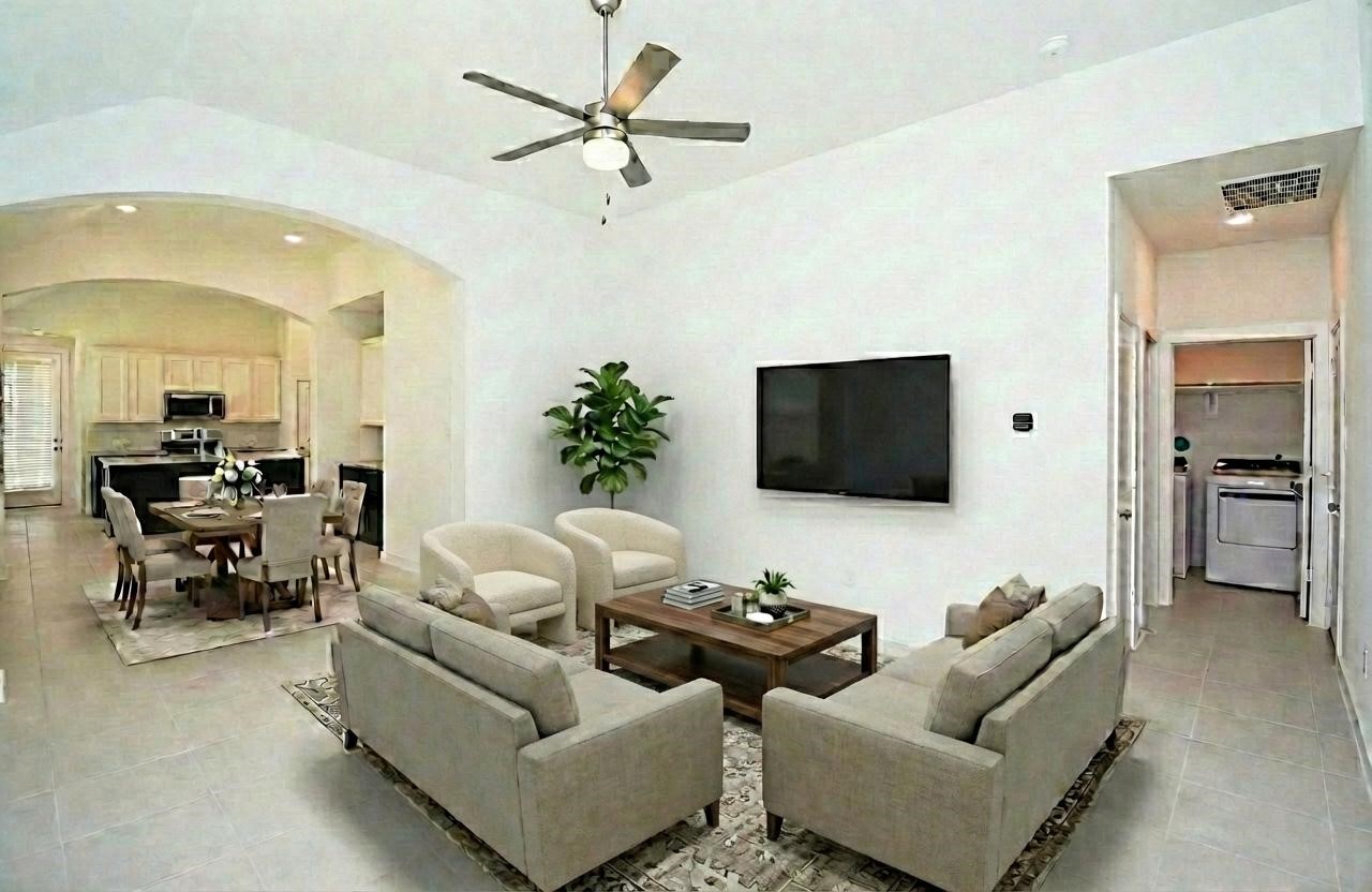 5115 Murillo Drive Manvel, TX 77578 - Photo 5 of 31 a living room with furniture and a flat screen tv