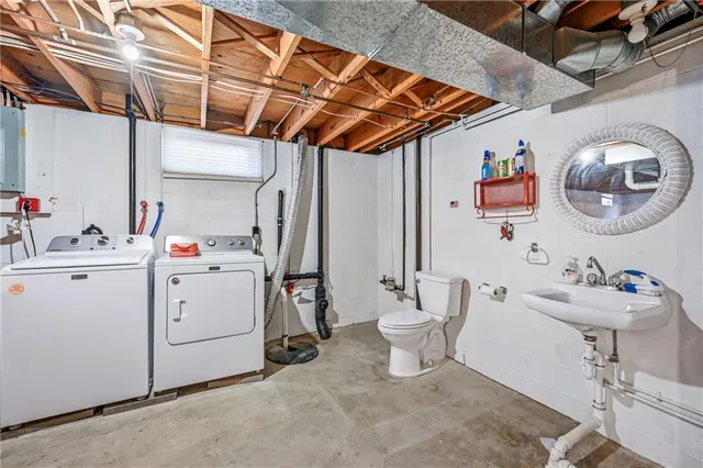 a utility room with dryer and washer