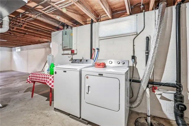 a utility room with dryer and washer