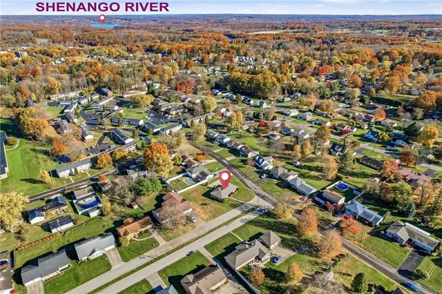 an aerial view of residential houses with outdoor space