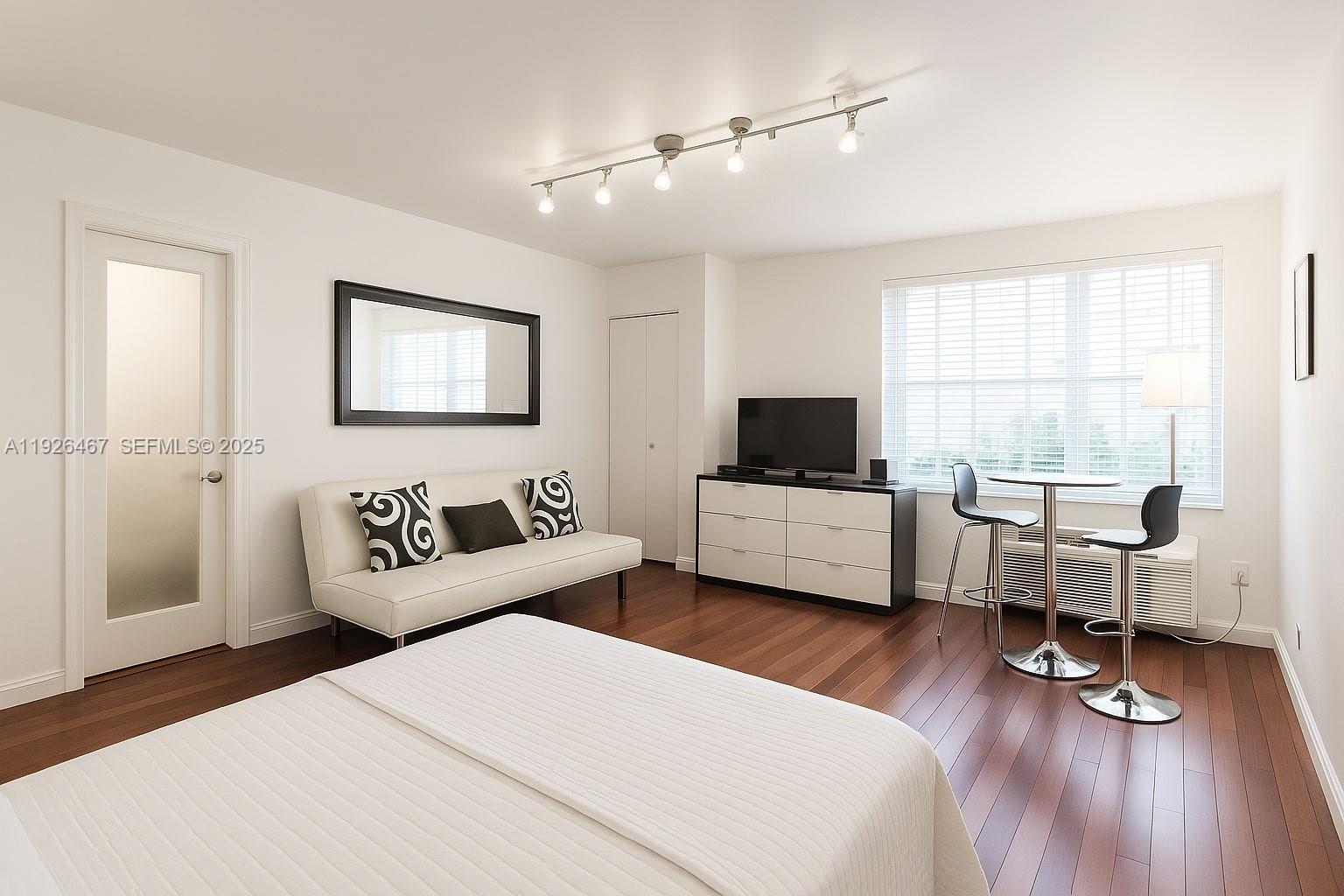 420 15th Street, Unit 106 Miami Beach, FL 33139 - Photo 3 of 9 a living room with furniture and a wooden floor