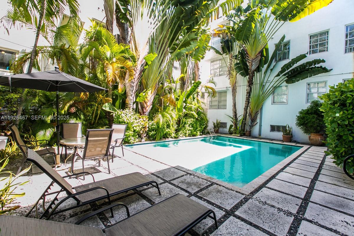 420 15th Street, Unit 106 Miami Beach, FL 33139 - Photo 8 of 9 a view of a backyard with a patio and fire pit