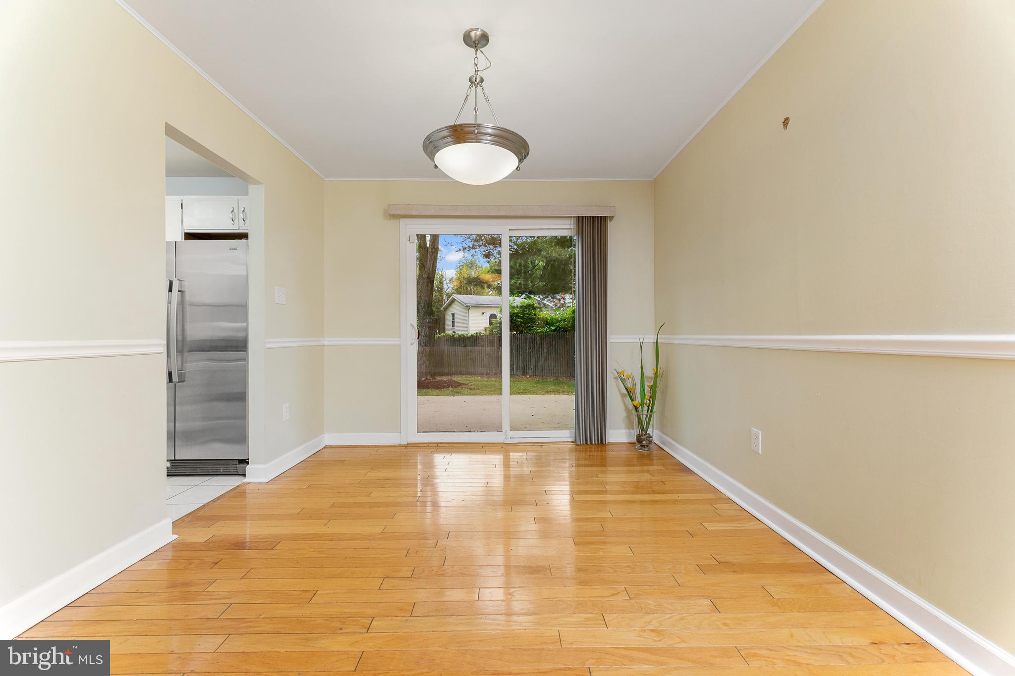 100 East Poplar Road Sterling, VA 20164 - Photo 8 of 23 Dining room leads to backyard