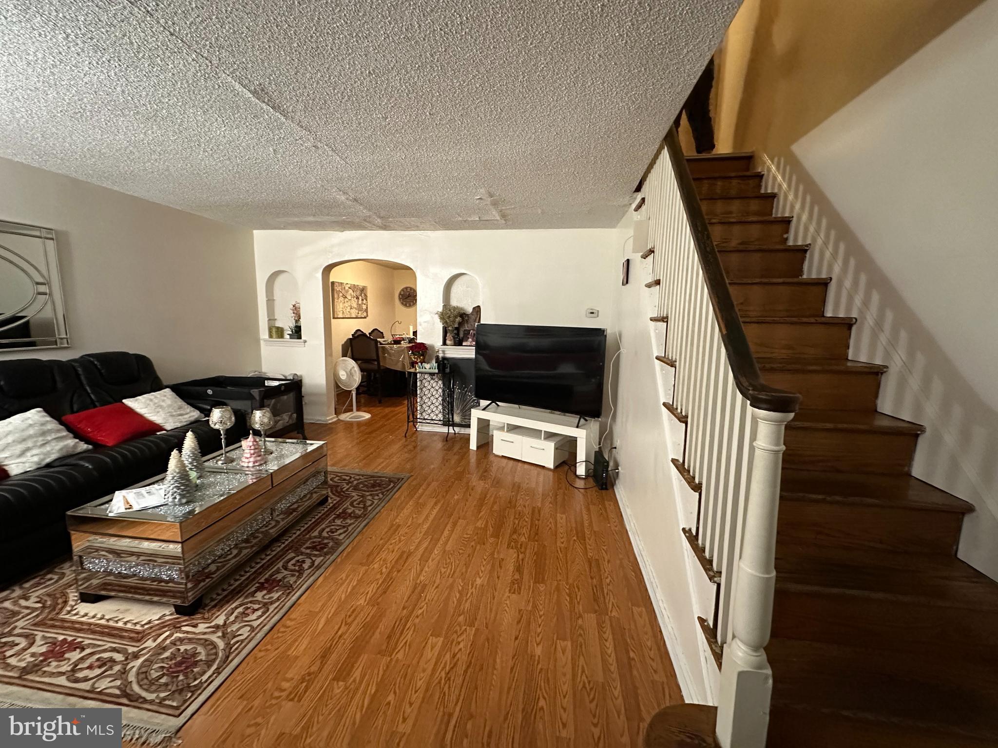 7143 Jackson Street Philadelphia, PA 19135 - Photo 13 of 23 a living room with furniture and a flat screen tv