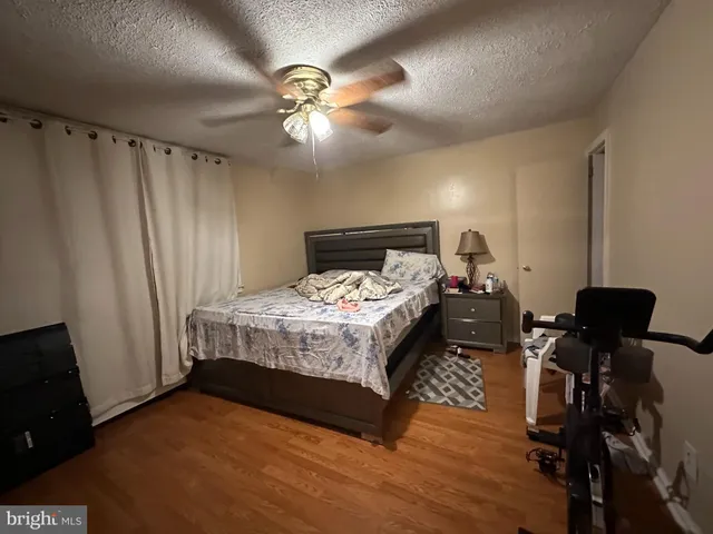 a bed sitting in a room next to a window