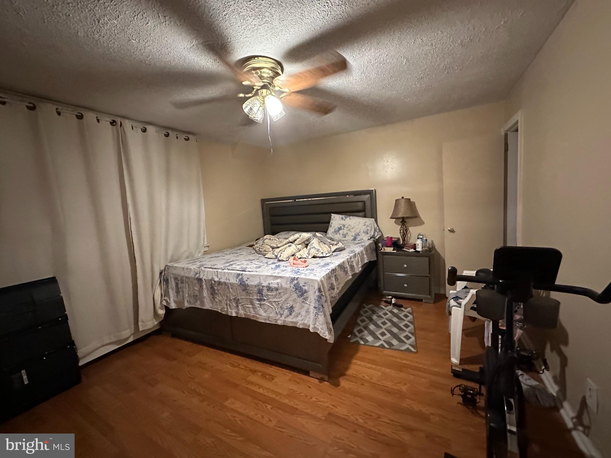 7143 Jackson Street Philadelphia, PA 19135 - Photo 16 of 23 a bed sitting in a room next to a window