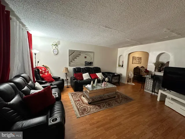 a living room with furniture or couch and a flat screen tv
