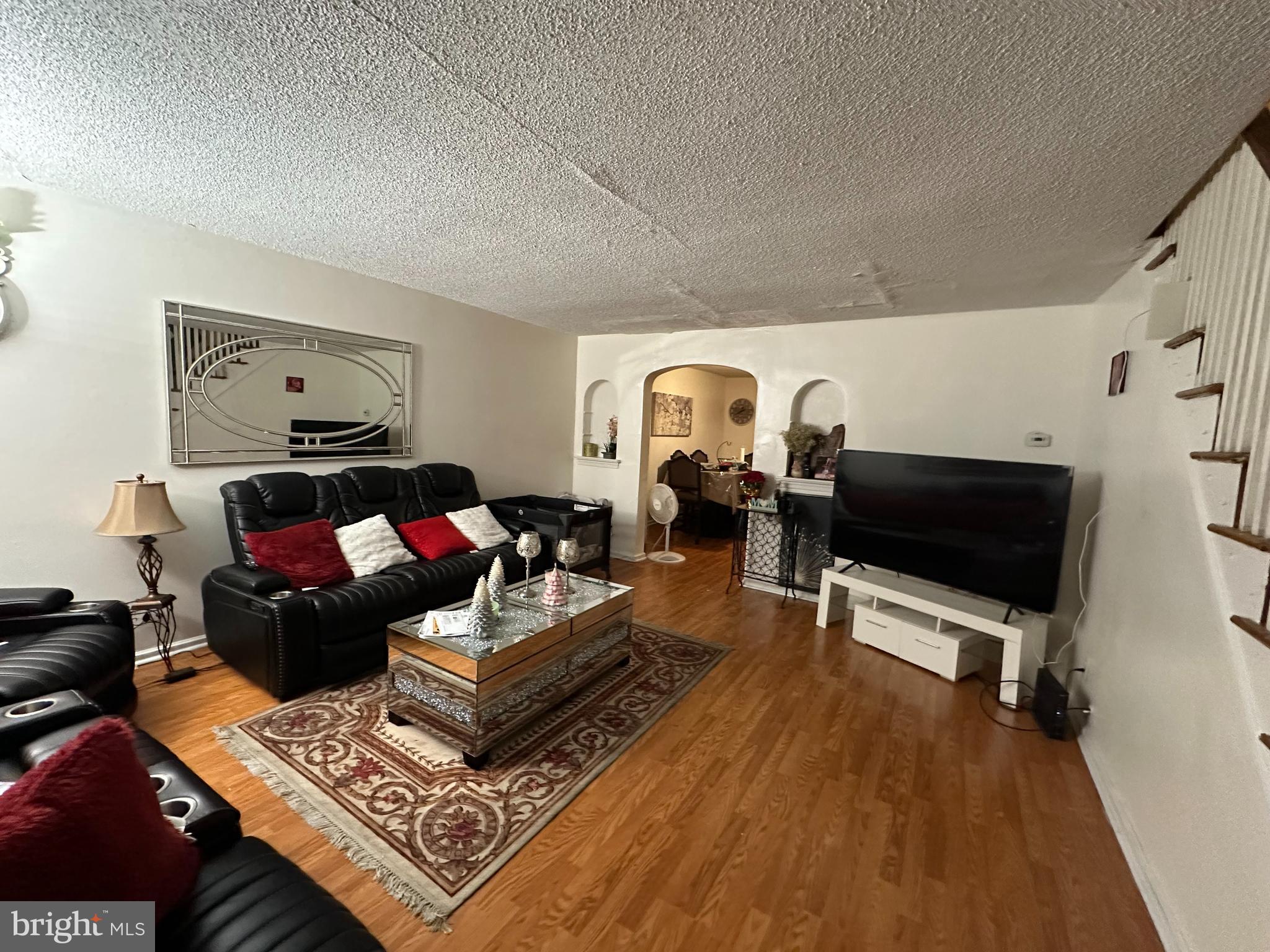 7143 Jackson Street Philadelphia, PA 19135 - Photo 4 of 23 a living room with furniture and a flat screen tv