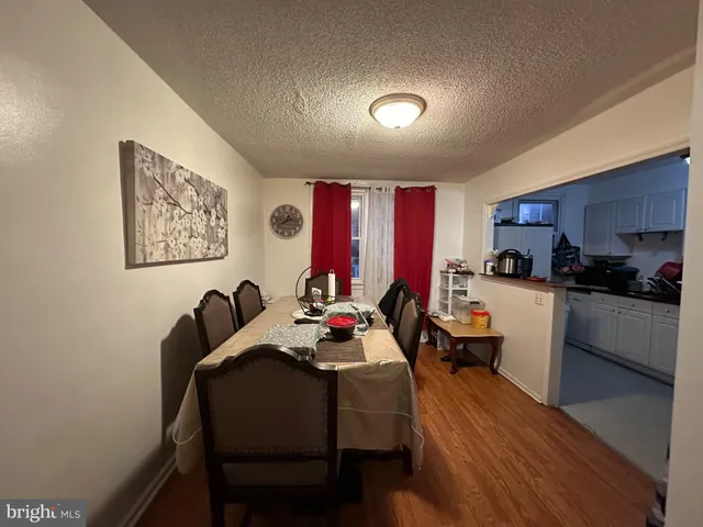 a dining room with a table and chairs