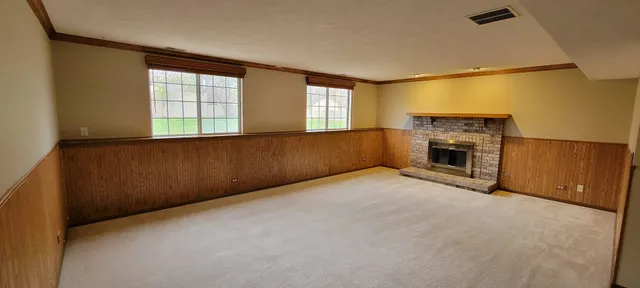 a view of a backyard with large tree