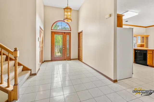 a view of an entryway with a chandelier