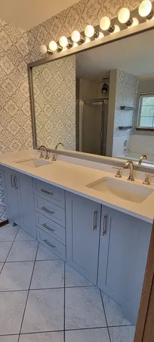 a bathroom with a sink and a mirror