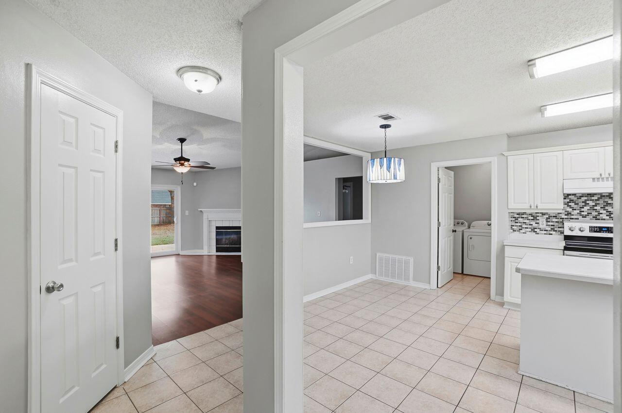 1285 Jefferyscot Drive Crestview, FL 32536 - Photo 14 of 41 a view of a hallway with wooden shelves