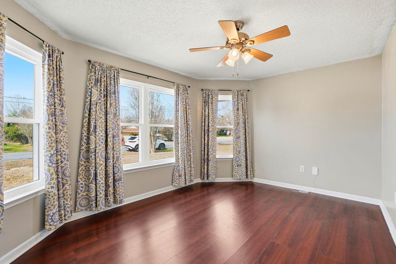 1285 Jefferyscot Drive Crestview, FL 32536 - Photo 17 of 41 an empty room with wooden floor and windows