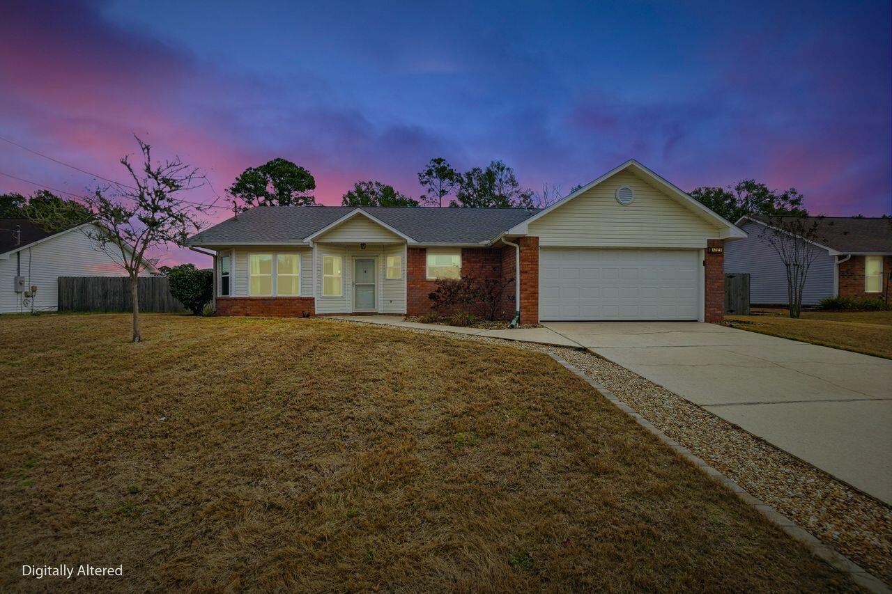 1285 Jefferyscot Drive Crestview, FL 32536 - Photo 2 of 41 a front view of a house with a yard