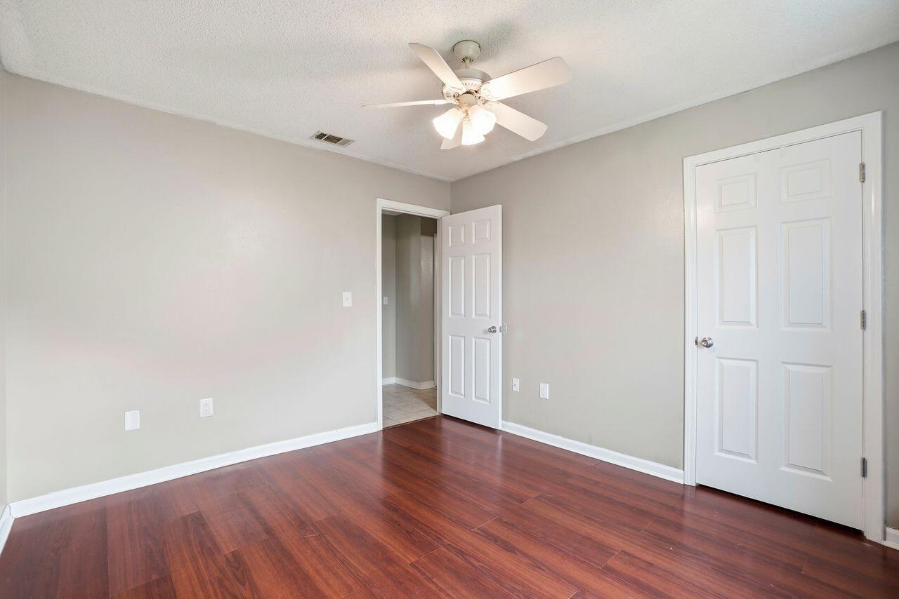 1285 Jefferyscot Drive Crestview, FL 32536 - Photo 21 of 41 a view of an empty room with wooden floor