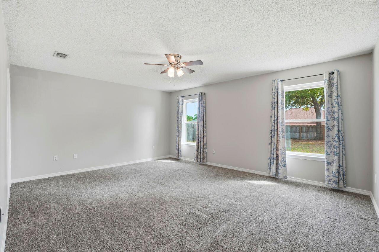 1285 Jefferyscot Drive Crestview, FL 32536 - Photo 24 of 41 an empty room with windows and closet