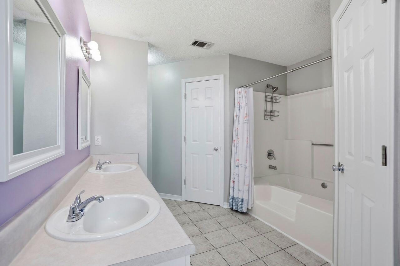 1285 Jefferyscot Drive Crestview, FL 32536 - Photo 28 of 41 a bathroom with a bathtub and a sink