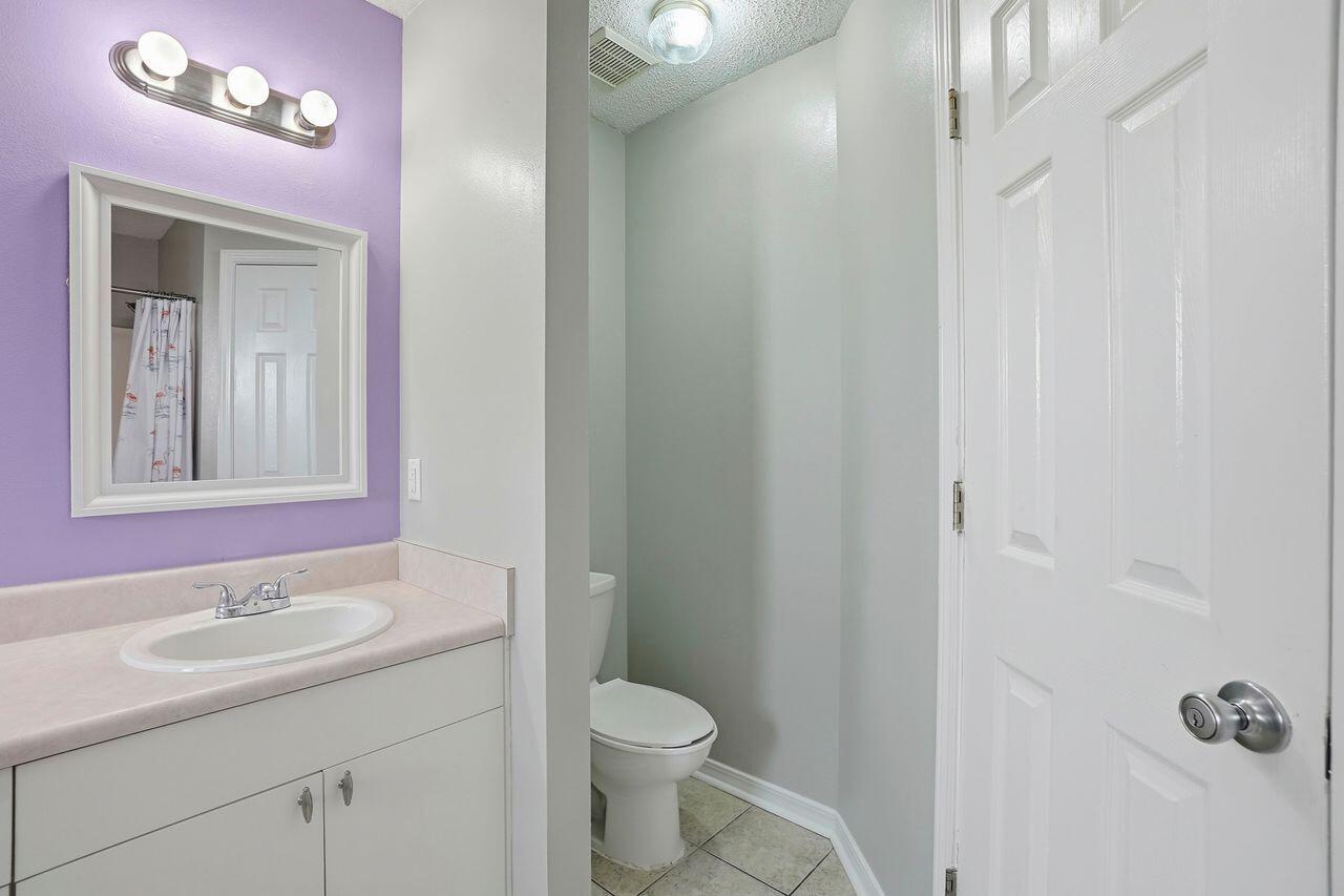 1285 Jefferyscot Drive Crestview, FL 32536 - Photo 29 of 41 a bathroom with a granite countertop sink toilet and shower