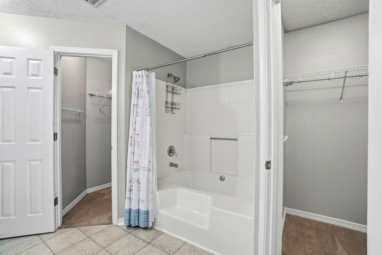 1285 Jefferyscot Drive Crestview, FL 32536 - Photo 30 of 41 a bathroom with a bathtub and a shower