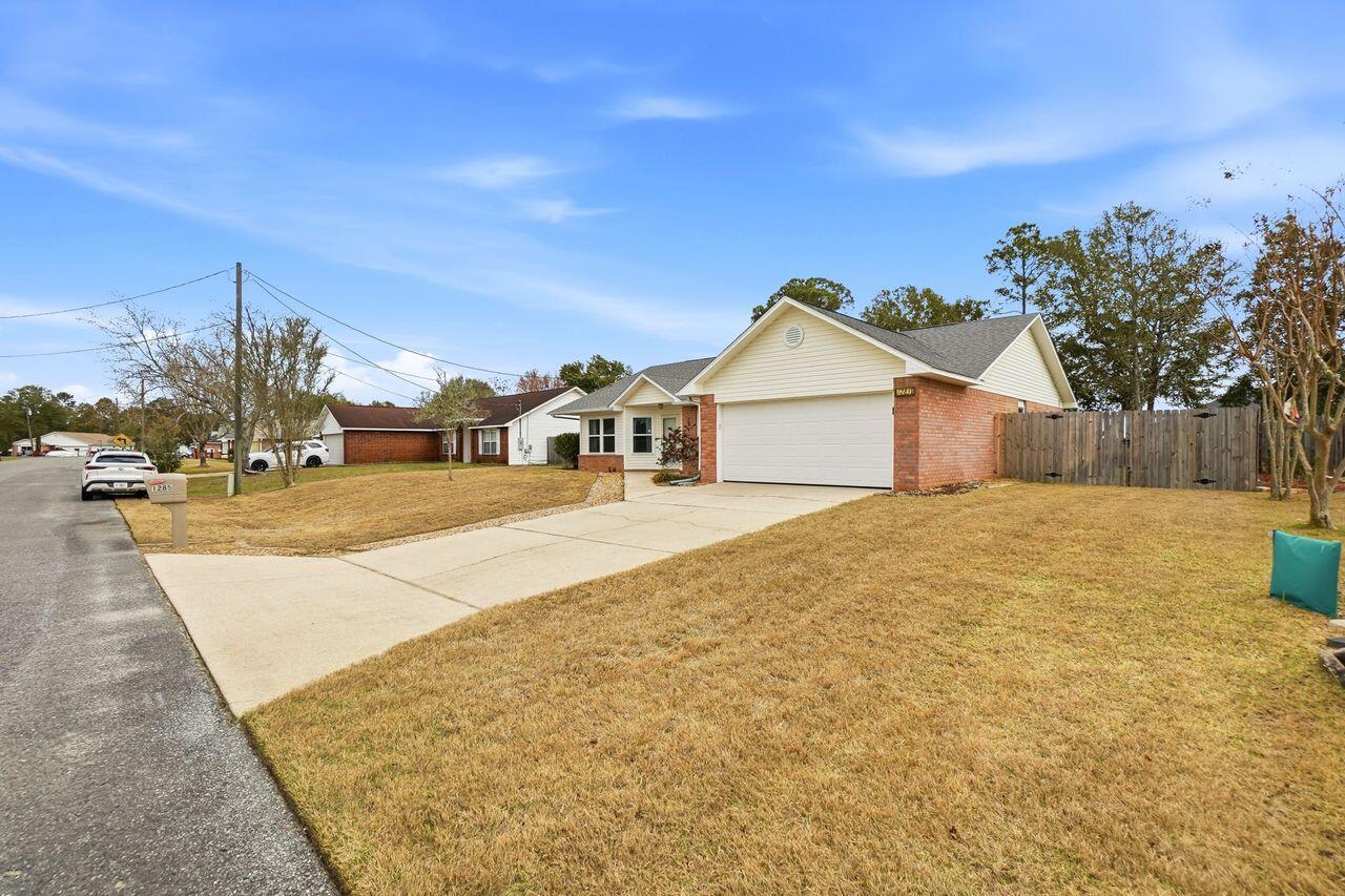 1285 Jefferyscot Drive Crestview, FL 32536 - Photo 3 of 41 a view of a house with a yard