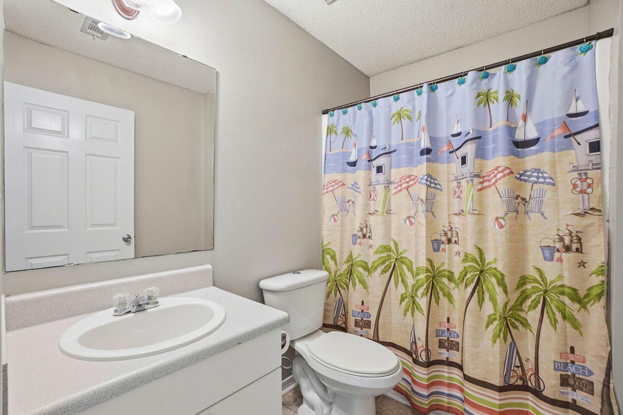 1285 Jefferyscot Drive Crestview, FL 32536 - Photo 31 of 41 a bathroom with a toilet sink and mirror