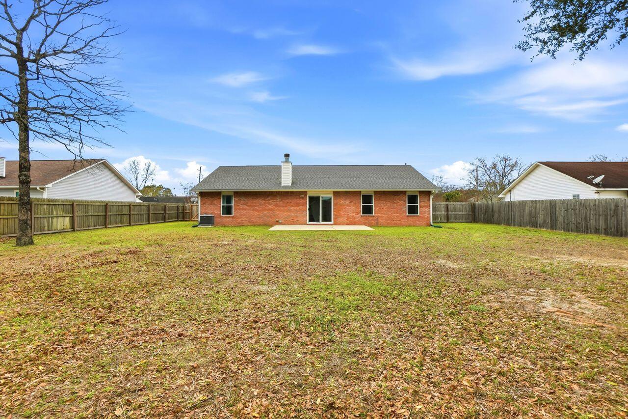 1285 Jefferyscot Drive Crestview, FL 32536 - Photo 37 of 41 a front view of a house with a yard