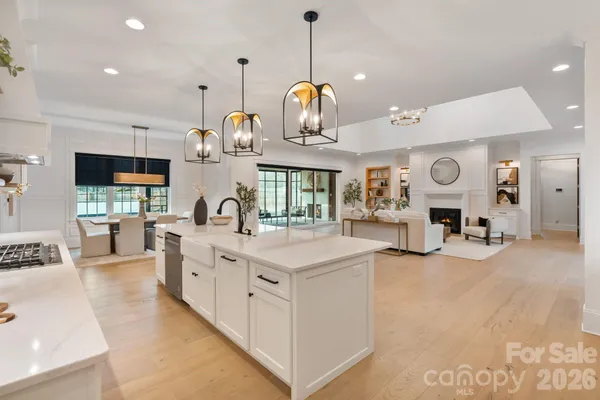a kitchen with cabinets a sink and appliances