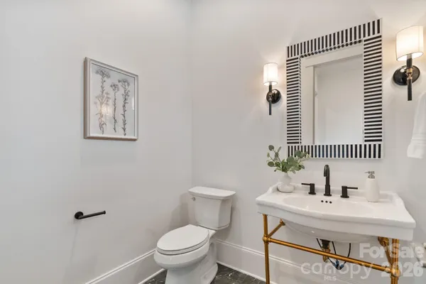a view of staircase with white walls and a window