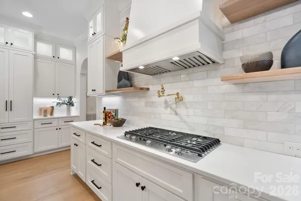 a kitchen with a refrigerator and a sink