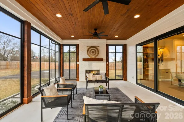 a view of residential houses with swimming pool and a yard
