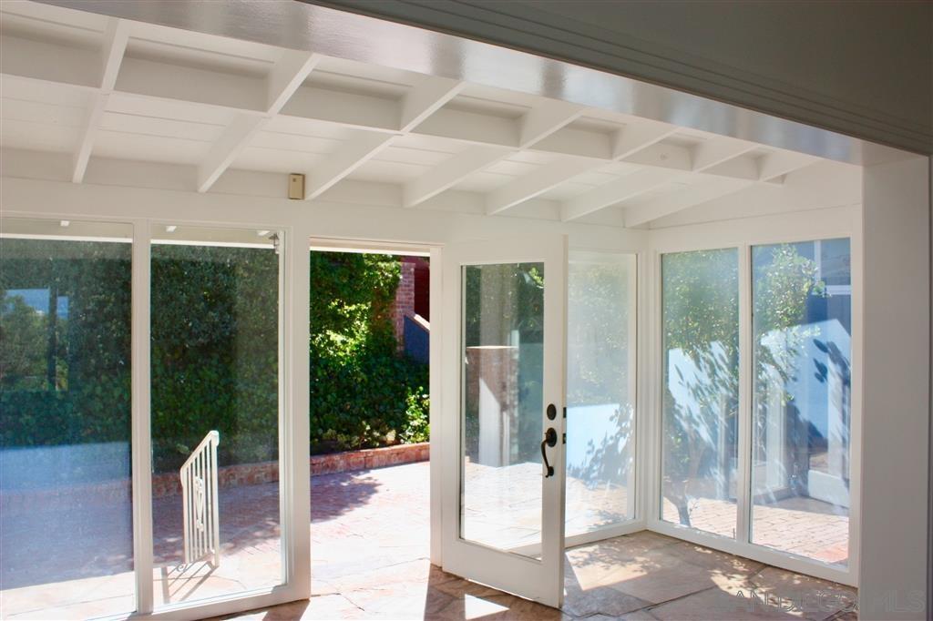 1516 Kearsarge Road La Jolla, CA 92037 - Photo 14 of 22 a living room with hardwood floor and garden view