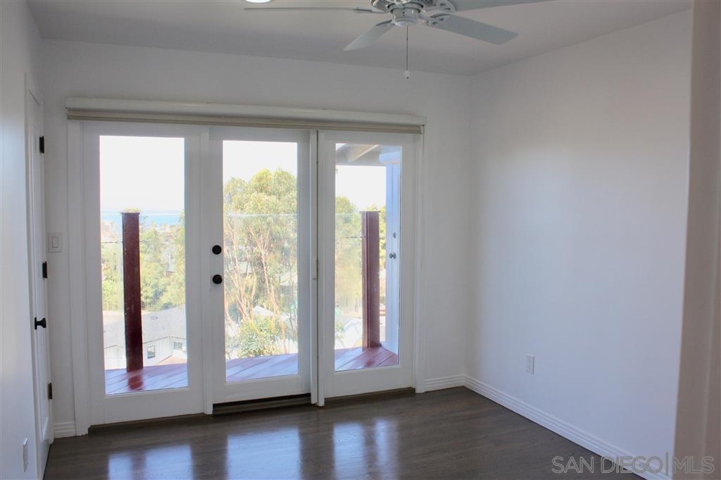 1516 Kearsarge Road La Jolla, CA 92037 - Photo 18 of 22 a view of room with wooden floor and window