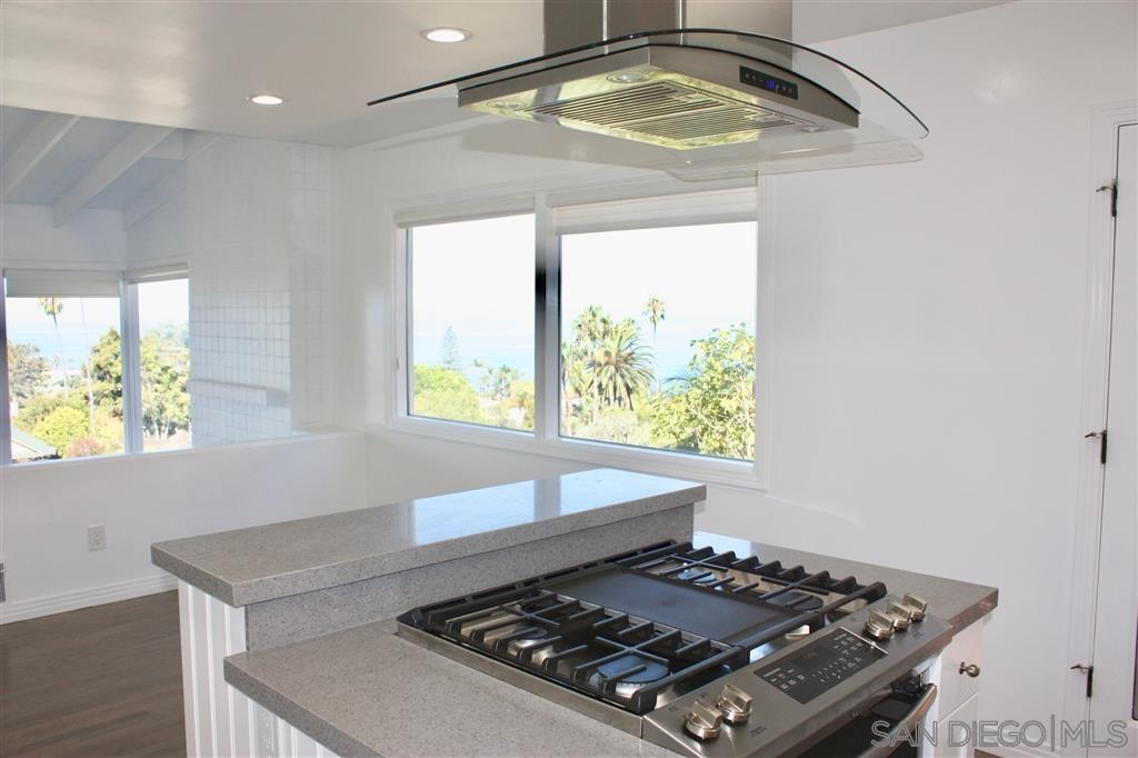 1516 Kearsarge Road La Jolla, CA 92037 - Photo 20 of 22 a stove top oven sitting inside of a kitchen