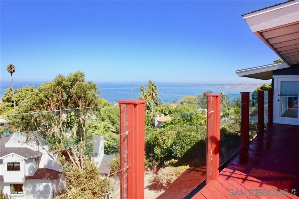 1516 Kearsarge Road La Jolla, CA 92037 - Photo 3 of 22 a street view with tall buildings