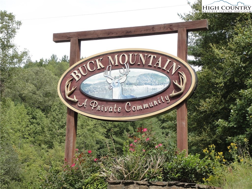Lot 87 Woodpecker Road Purlear, NC 28665 - Photo 1 of 30 a sign that is sitting on a wall